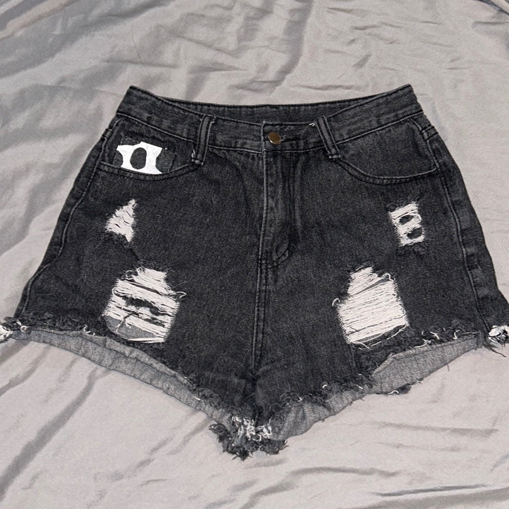 Custom cow print painted, high waisted, jean shorts.
